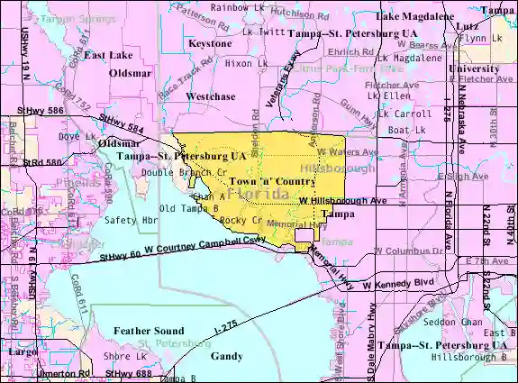 A map highlighting the census-designated place of Town 'n' Country, Florida in yellow, bordered by Old Tampa Bay to the south and west, with surrounding areas shown in pink and blue.